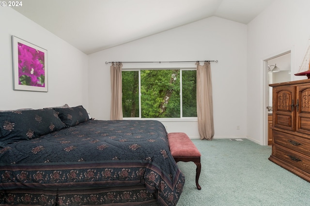 bedroom featuring carpet floors and vaulted ceiling