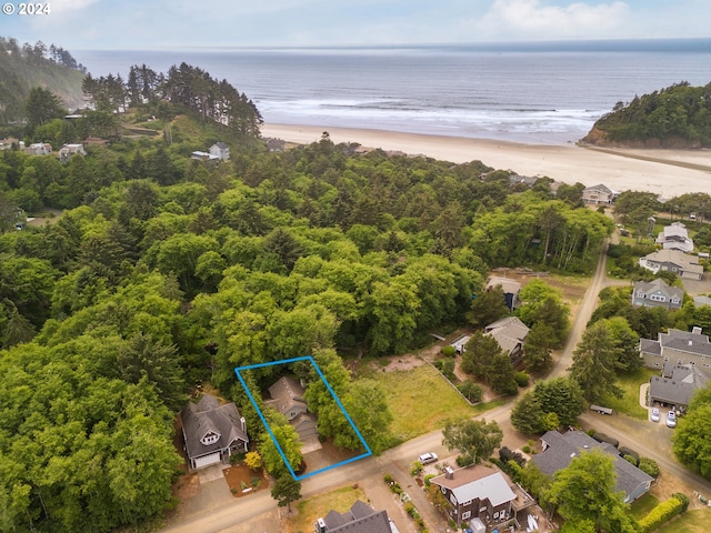 aerial view featuring a water view and a beach view