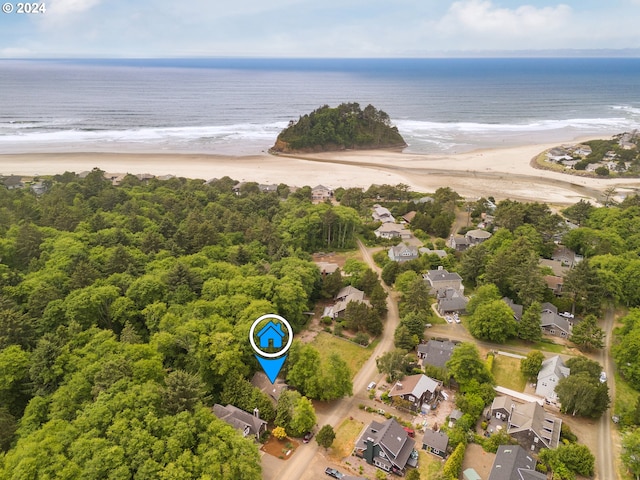 aerial view with a water view and a beach view