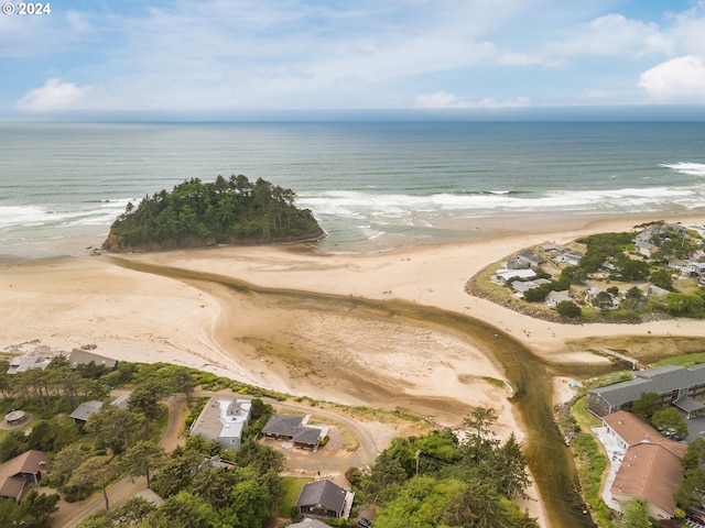 aerial view with a water view and a beach view