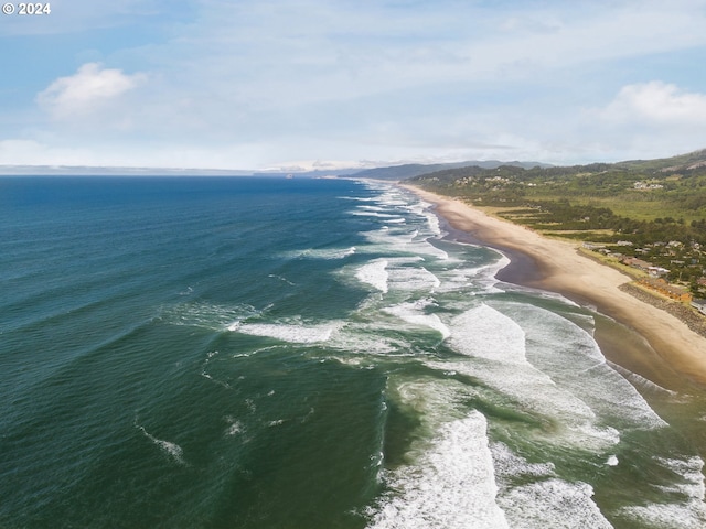 aerial view featuring a water view and a view of the beach