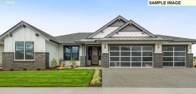 view of front of home with a garage and a front yard