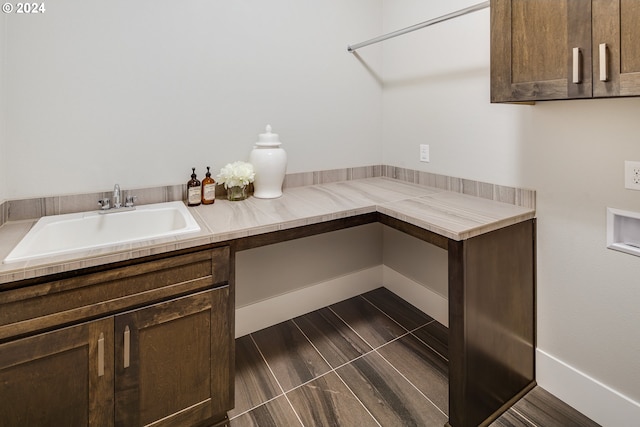 interior space featuring sink and dark brown cabinets