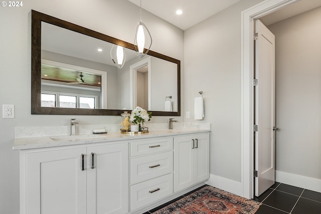 bathroom featuring ceiling fan, tile patterned floors, and vanity