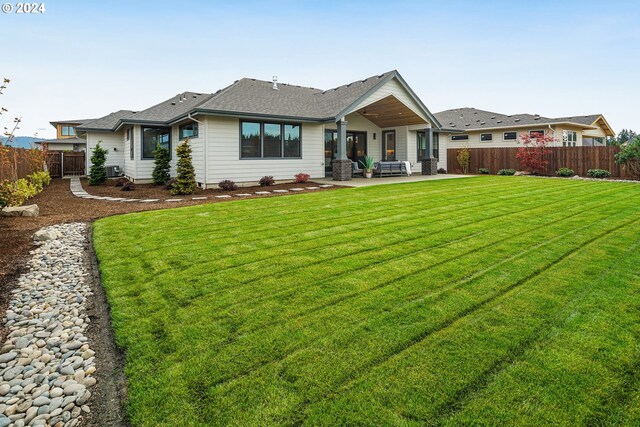 view of front facade with a patio area and a front lawn