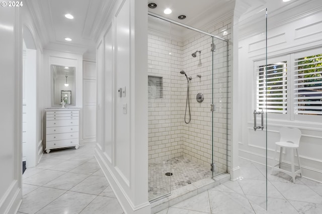 bathroom featuring crown molding, vanity, walk in shower, and tile patterned floors