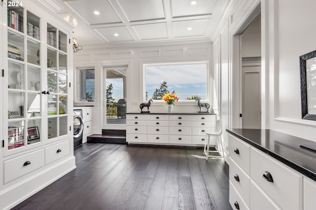 walk in closet featuring dark hardwood / wood-style flooring, washer / dryer, and coffered ceiling