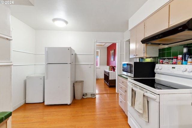 kitchen featuring white cabinets, white appliances, and light hardwood / wood-style flooring