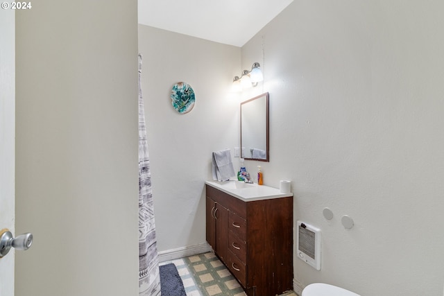 bathroom featuring vanity and heating unit