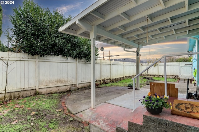 view of patio terrace at dusk