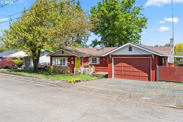 ranch-style house featuring a garage