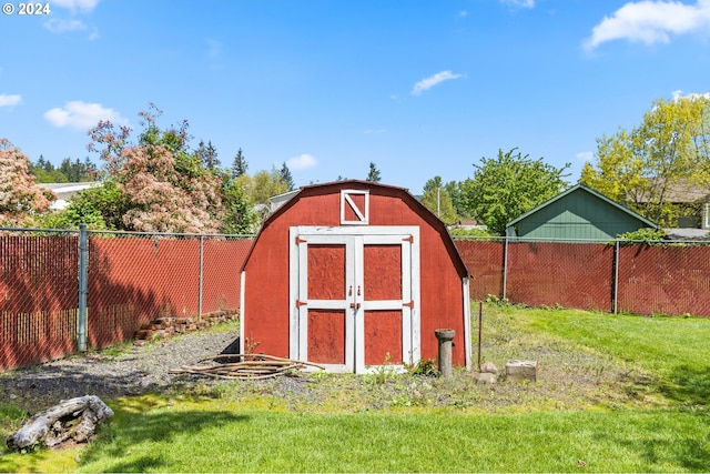 view of shed / structure with a lawn