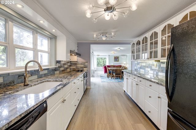 kitchen featuring black appliances, white cabinetry, a healthy amount of sunlight, and sink