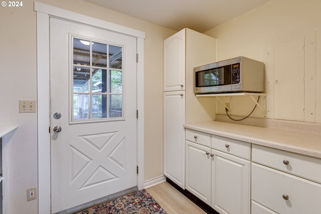 doorway with light hardwood / wood-style floors