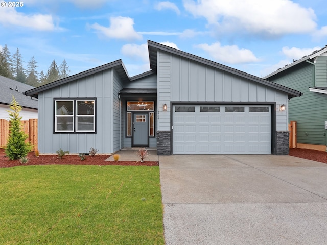 view of front facade featuring a front yard and a garage