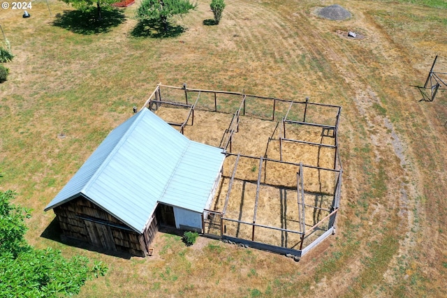 birds eye view of property with a rural view