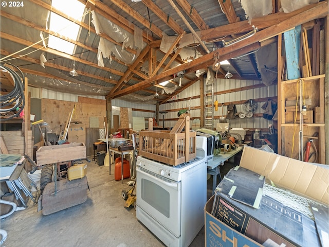 misc room with lofted ceiling and concrete flooring