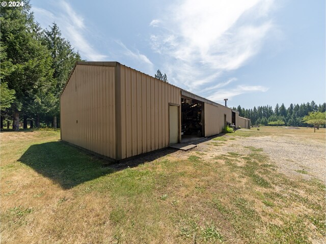 view of outdoor structure with a yard