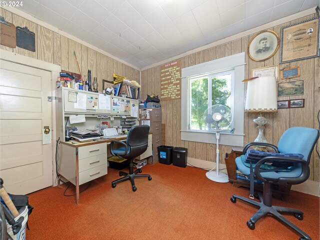 carpeted office with wooden walls