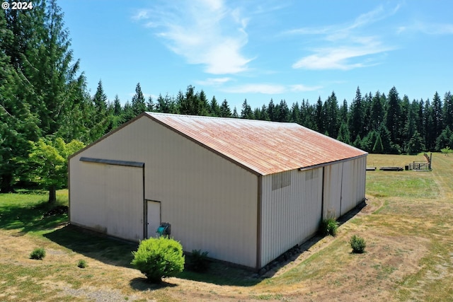 view of outdoor structure featuring a lawn