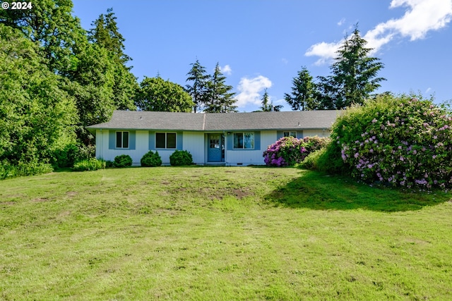 ranch-style home with a front lawn