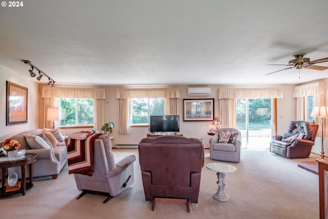 carpeted living room with ceiling fan, rail lighting, a wall mounted air conditioner, and a baseboard heating unit