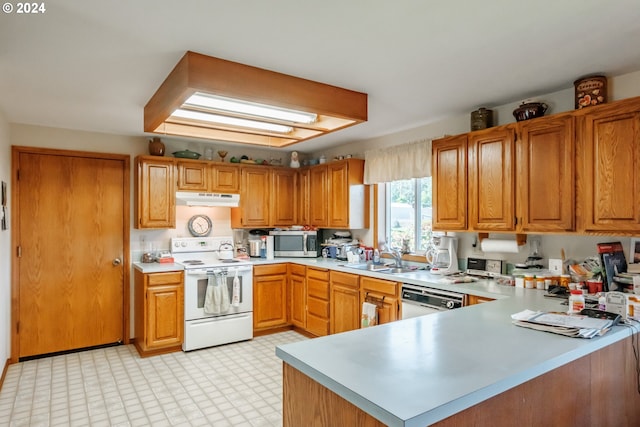 kitchen with kitchen peninsula, sink, and stainless steel appliances