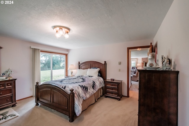 carpeted bedroom with a textured ceiling