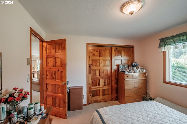 bedroom with light colored carpet