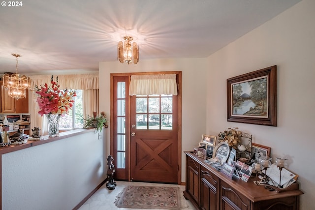 entrance foyer with a chandelier