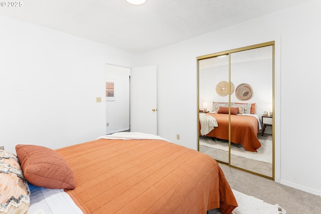 carpeted bedroom featuring a closet