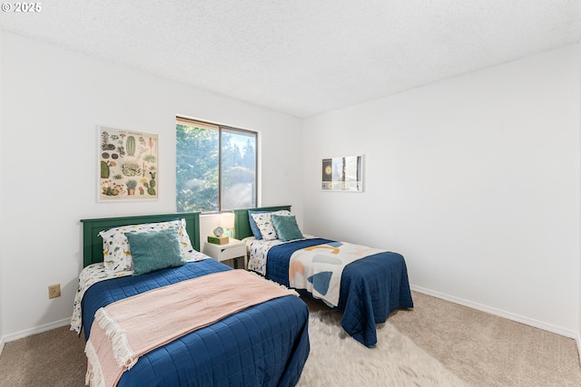 carpeted bedroom featuring a textured ceiling