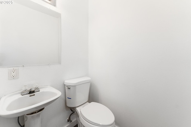 bathroom with sink and toilet