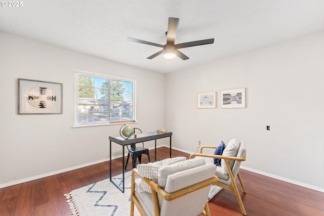 office space featuring ceiling fan and dark hardwood / wood-style flooring