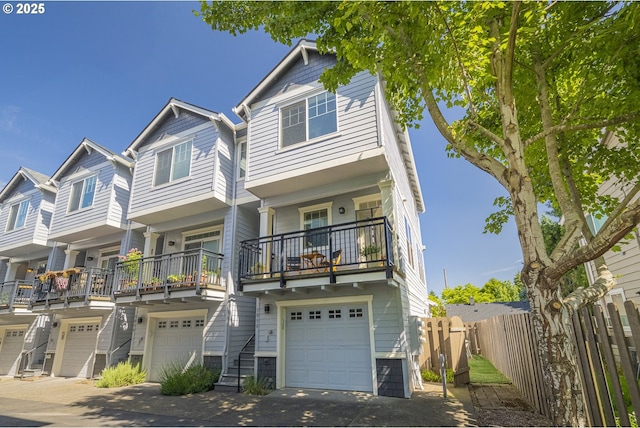 3050 SE 50th Ave Unit 6, Portland, OR 97206 - view of property featuring a garage and a balcony