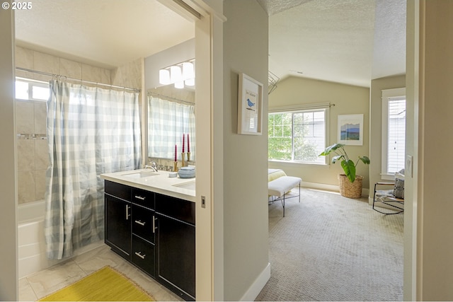 3050 SE 50th Ave Unit 6, Portland, OR 97206 - bathroom featuring healthy amount of natural light, shower / tub combo with curtain, double vanity, vaulted ceiling, and a textured ceiling