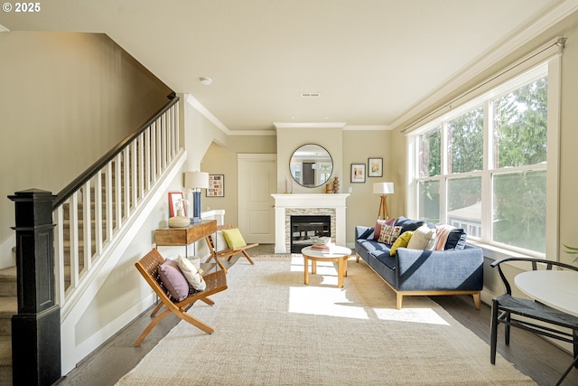 3050 SE 50th Ave Unit 6, Portland, OR 97206 - living area with wood finished floors, stairs, baseboards, crown molding, and a stone fireplace