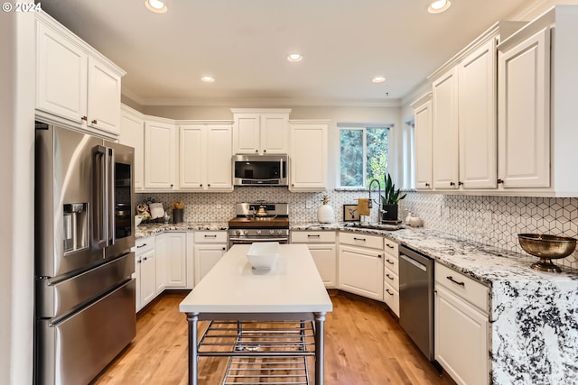 20160 SW 58th Ter, Tualatin, OR 97062 - living area with a tile fireplace, wood finished floors, and visible vents