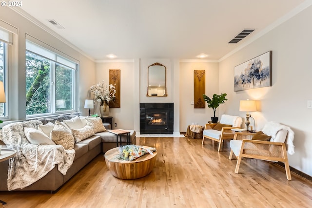 20160 SW 58th Ter, Tualatin, OR 97062 - living area with a tile fireplace, wood finished floors, and visible vents