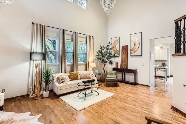 20160 SW 58th Ter, Tualatin, OR 97062 - living room with plenty of natural light, light wood-style flooring, and a towering ceiling