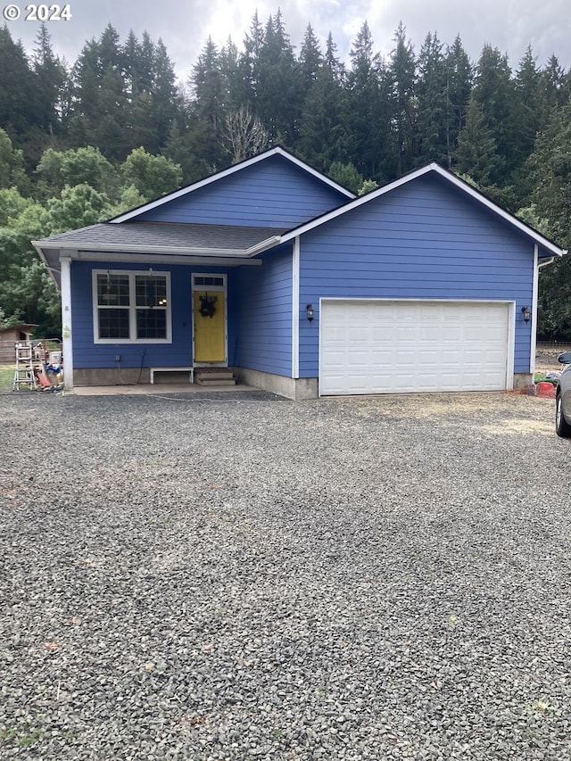 view of front facade featuring a garage and a porch