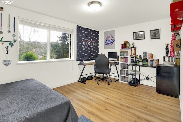 19500 S Rockie Dr, Mulino, OR 97042 - bedroom with wood finished floors, a desk, and baseboards