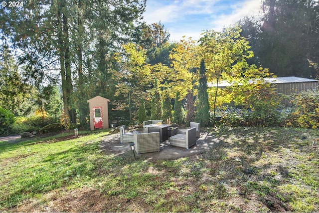 19500 S Rockie Dr, Mulino, OR 97042 - view of yard with outdoor lounge area, a storage shed, a patio, and an outbuilding