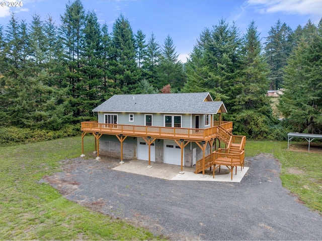 view of front of house with a front yard and a garage