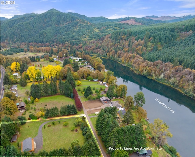 aerial view featuring a water and mountain view