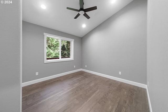 spare room with ceiling fan, lofted ceiling, and hardwood / wood-style floors