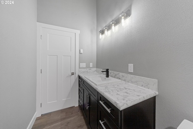 bathroom featuring vanity and hardwood / wood-style flooring