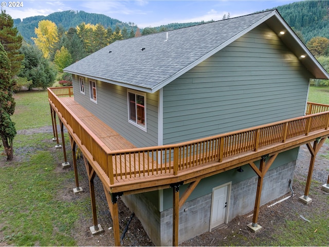 back of house featuring a deck with mountain view