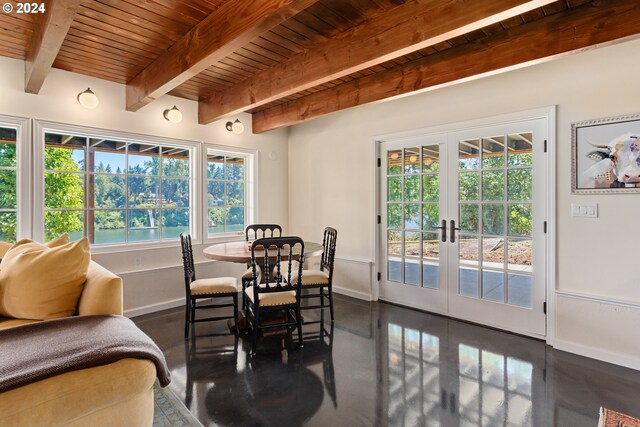 dining room with french doors, beam ceiling, and wooden ceiling