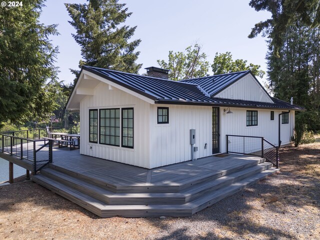 back of house with a wooden deck